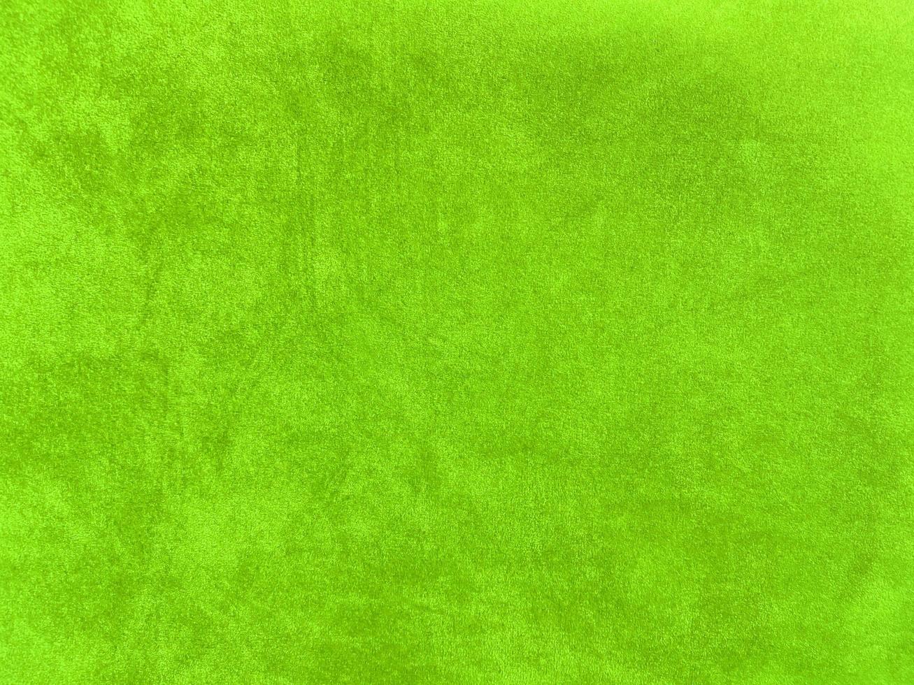 Light green velvet fabric texture used as background. Empty light green fabric background of soft and smooth textile material. There is space for text... photo
