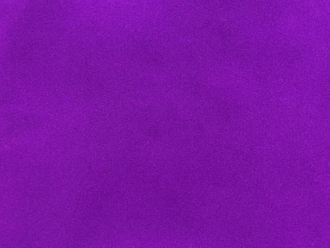 Purple velvet fabric texture used as background. Empty purple fabric background of soft and smooth textile material. There is space for text. photo
