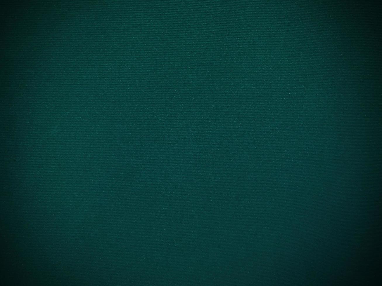 Dark green old velvet fabric texture used as background. Empty green fabric background of soft and smooth textile material. There is space for text. photo