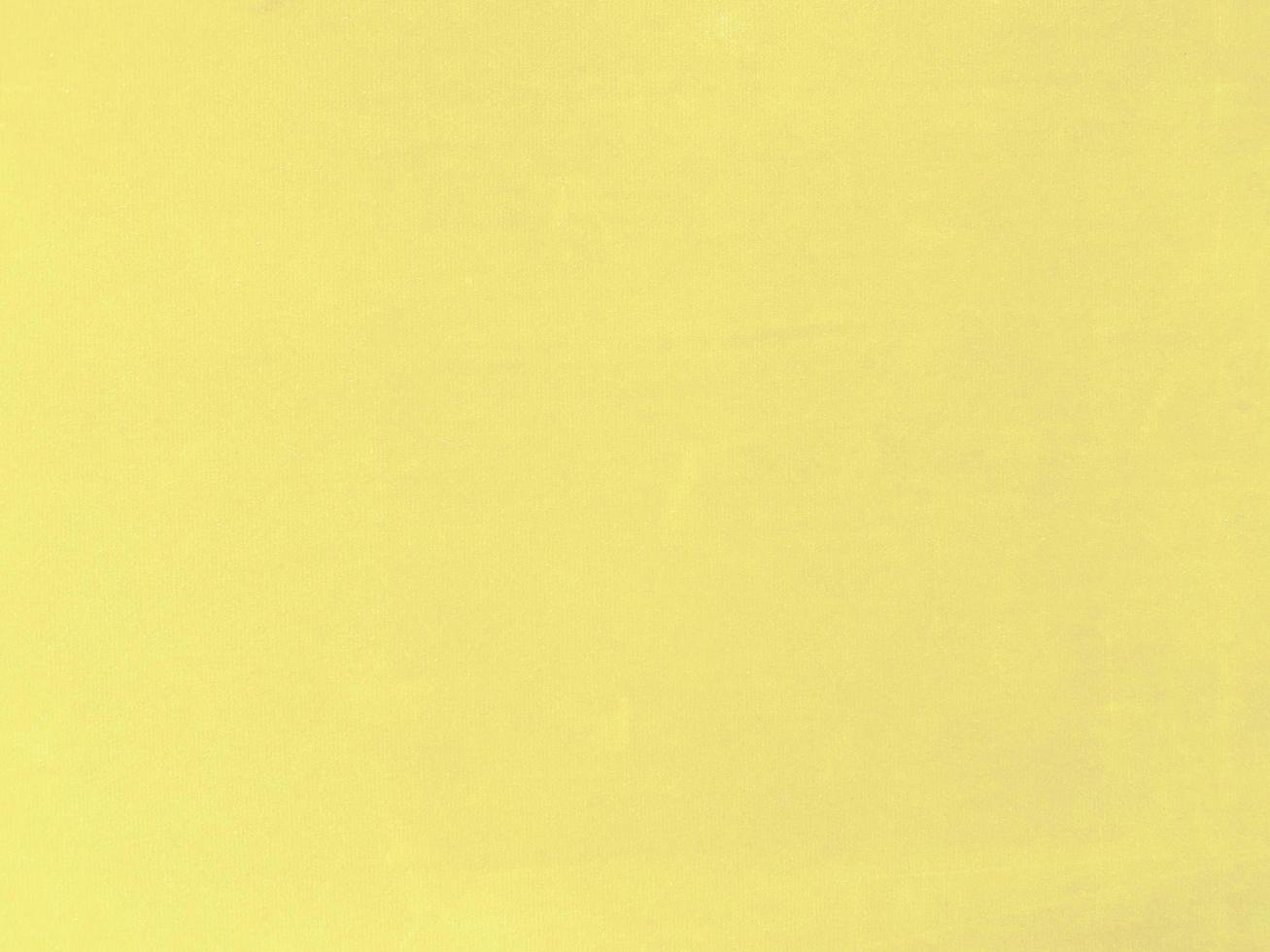 Pastel yellow velvet fabric texture used as background. Empty yellow fabric background of soft and smooth textile material. There is space for text. photo