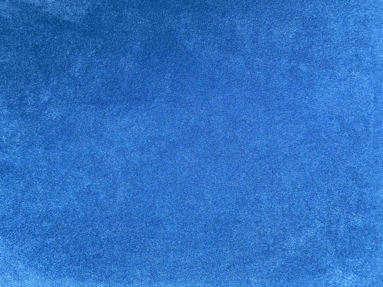 Light blue velvet fabric texture used as background. Empty light blue