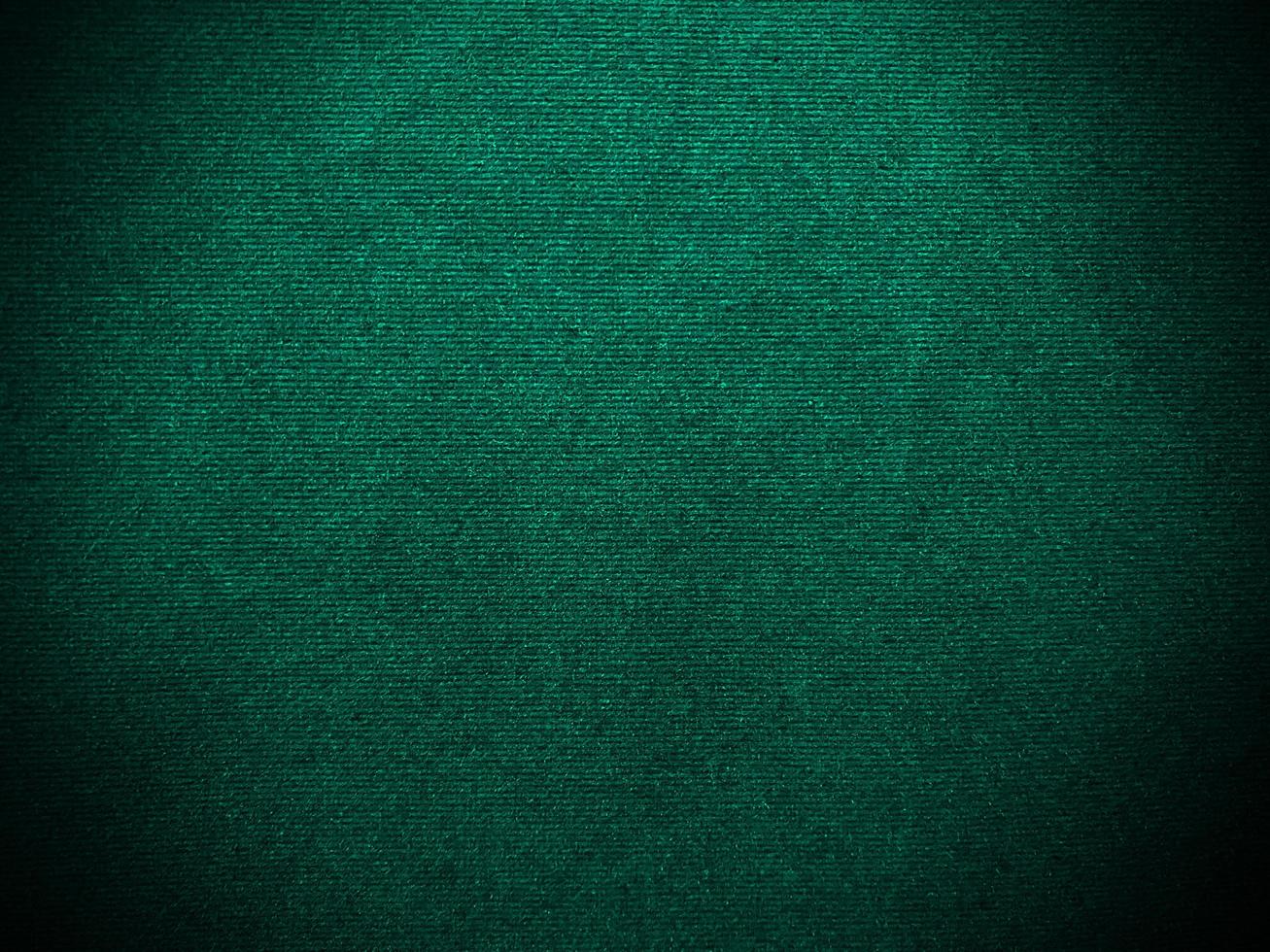 Dark green old velvet fabric texture used as background. Empty green fabric background of soft and smooth textile material. There is space for text.. photo