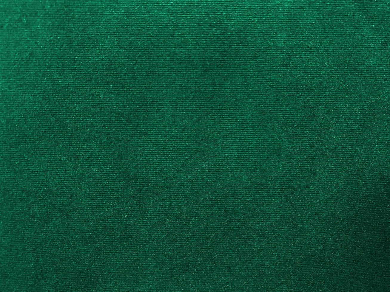 Dark green old velvet fabric texture used as background. Empty green fabric background of soft and smooth textile material. There is space for text.. photo
