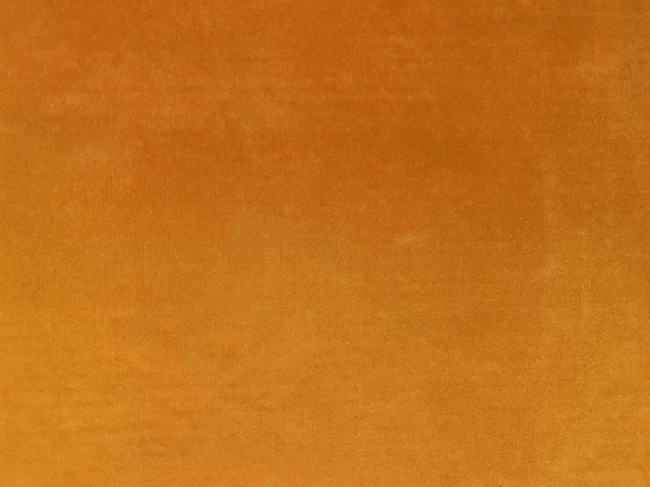 Orange old velvet fabric texture used as background. Empty orange fabric background of soft and smooth textile material. There is space for text. photo