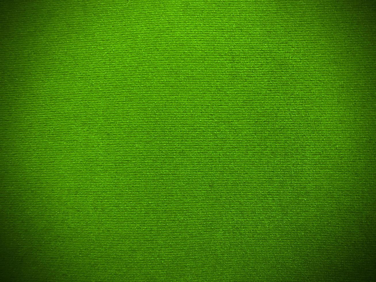 Green velvet fabric texture used as background. Empty green fabric background of soft and smooth textile material. There is space for text. photo