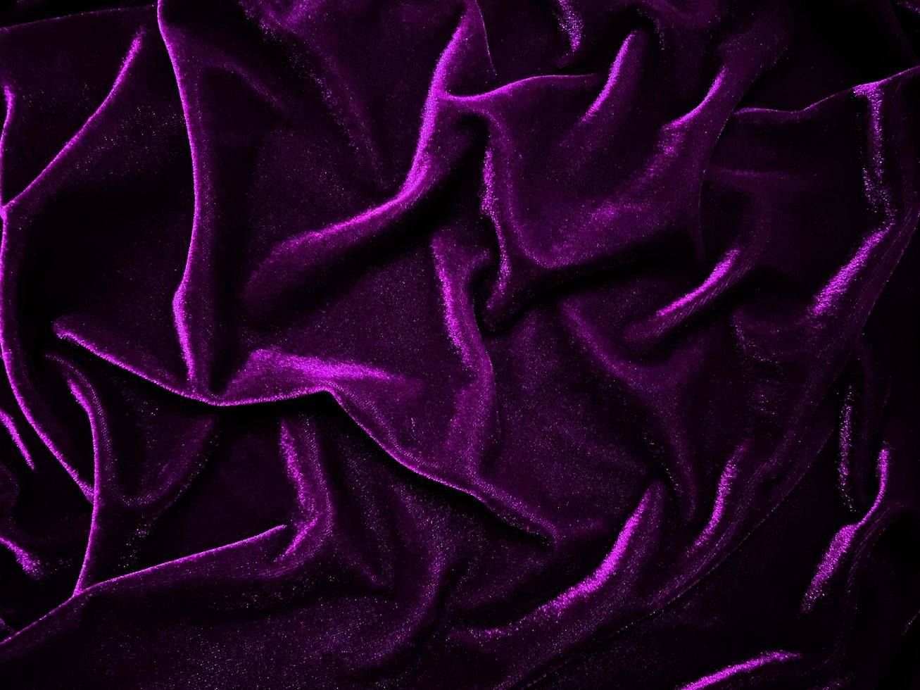 Purple velvet fabric texture used as background. Empty purple fabric background of soft and smooth textile material. There is space for text. photo