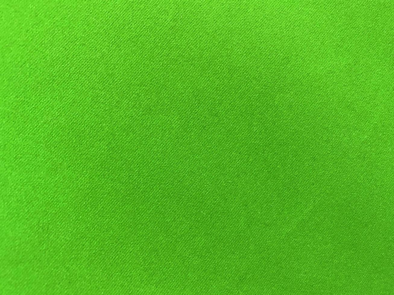 Green old velvet fabric texture used as background. Empty green fabric background of soft and smooth textile material. There is space for text.. photo