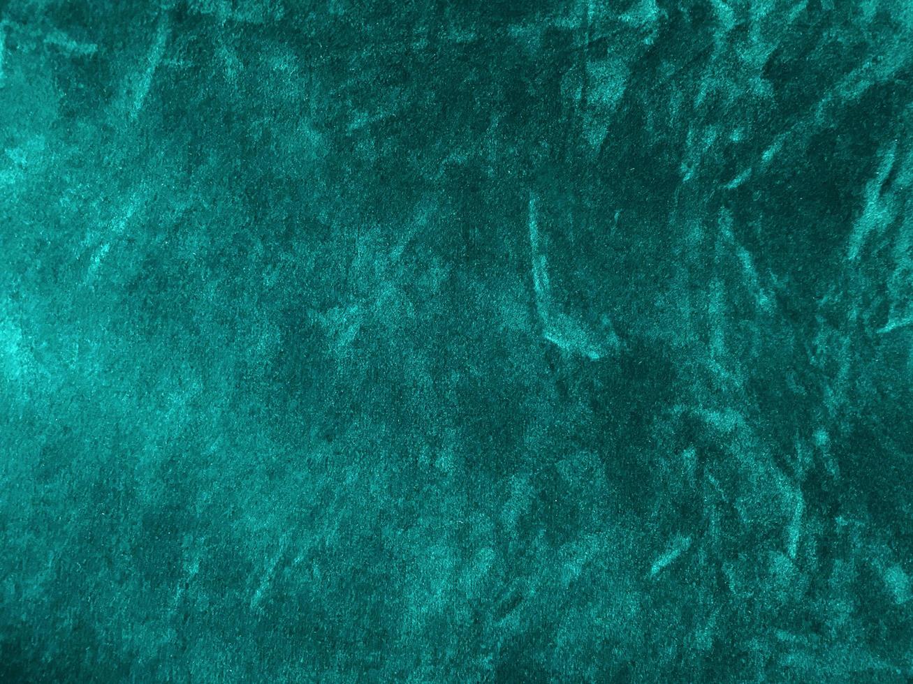 Dark green old velvet fabric texture used as background. Empty green fabric background of soft and smooth textile material. There is space for text.. photo