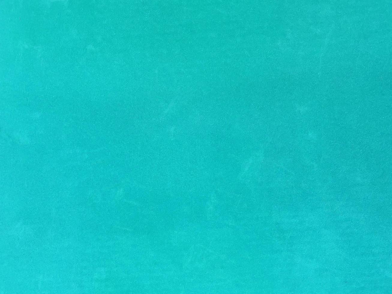 turquoise old velvet fabric texture used as background. Empty turquoise fabric background of soft and smooth textile material. There is space for text. photo