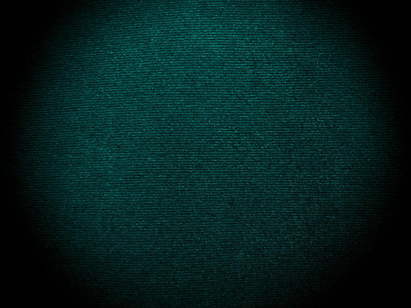 Dark green old velvet fabric texture used as background. Empty green fabric background of soft and smooth textile material. There is space for text... photo