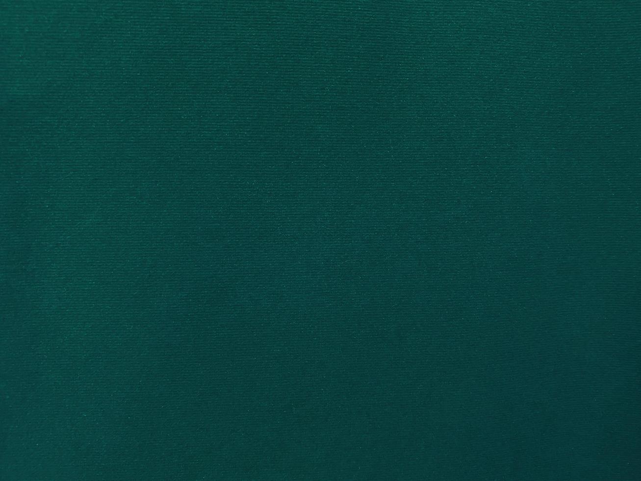 Dark green old velvet fabric texture used as background. Empty green fabric background of soft and smooth textile material. There is space for text. photo