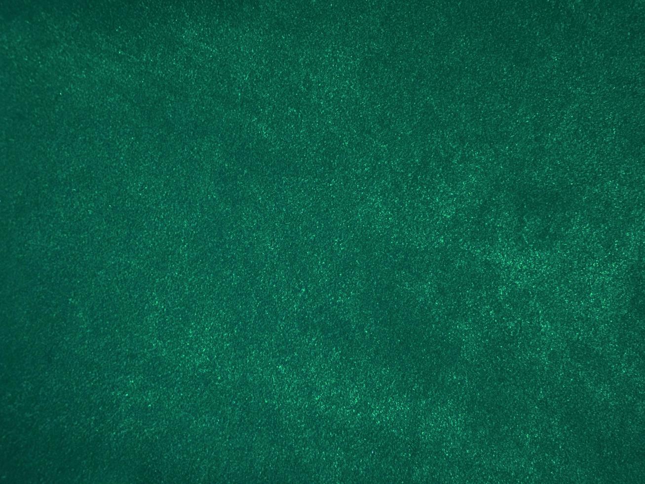 Dark green old velvet fabric texture used as background. Empty green fabric background of soft and smooth textile material. There is space for text... photo