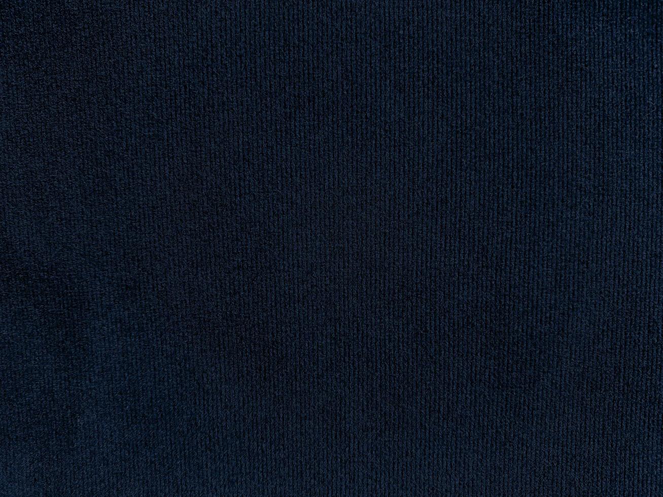 Dark blue velvet fabric texture used as background. Empty dark blue fabric background of soft and smooth textile material. There is space for text. photo