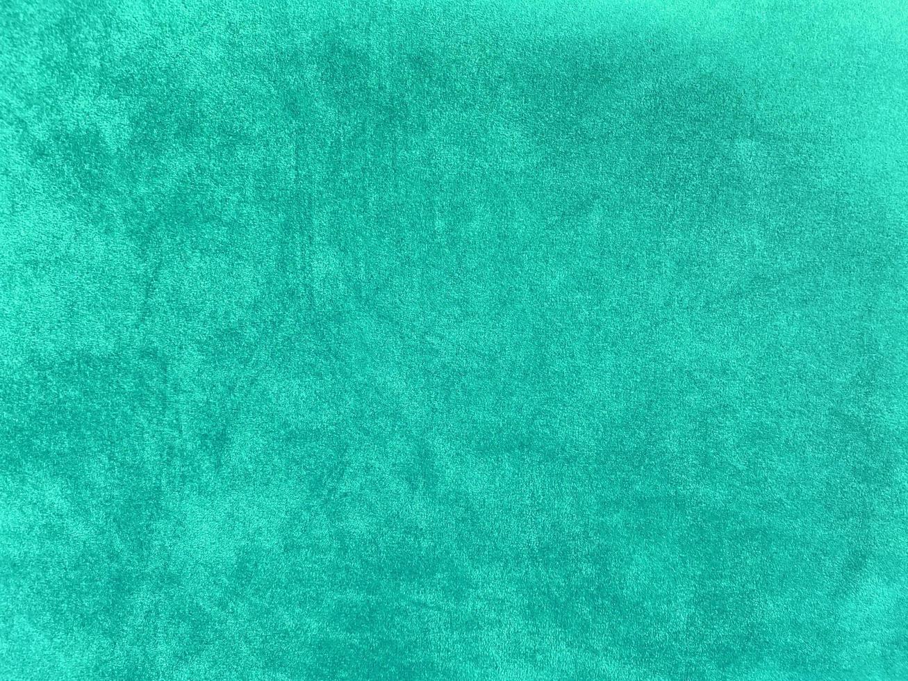 Dark green old velvet fabric texture used as background. Empty green fabric background of soft and smooth textile material. There is space for text... photo