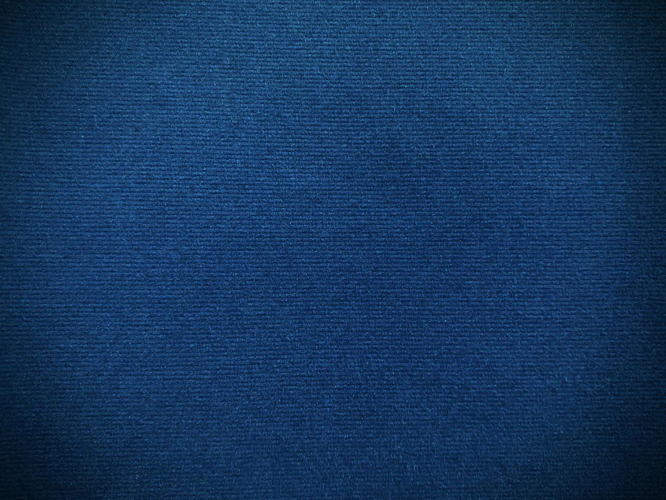 Dark blue velvet fabric texture used as background. Empty dark blue fabric background of soft and smooth textile material. There is space for text. photo