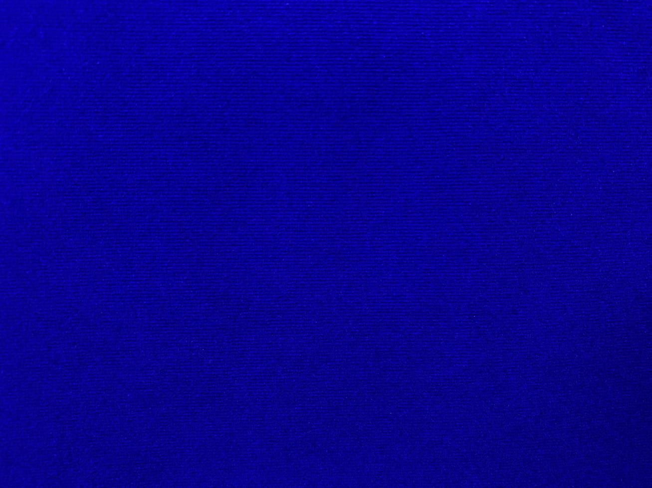 Blue velvet fabric texture used as background. Empty blue fabric background of soft and smooth textile material. There is space for text. photo