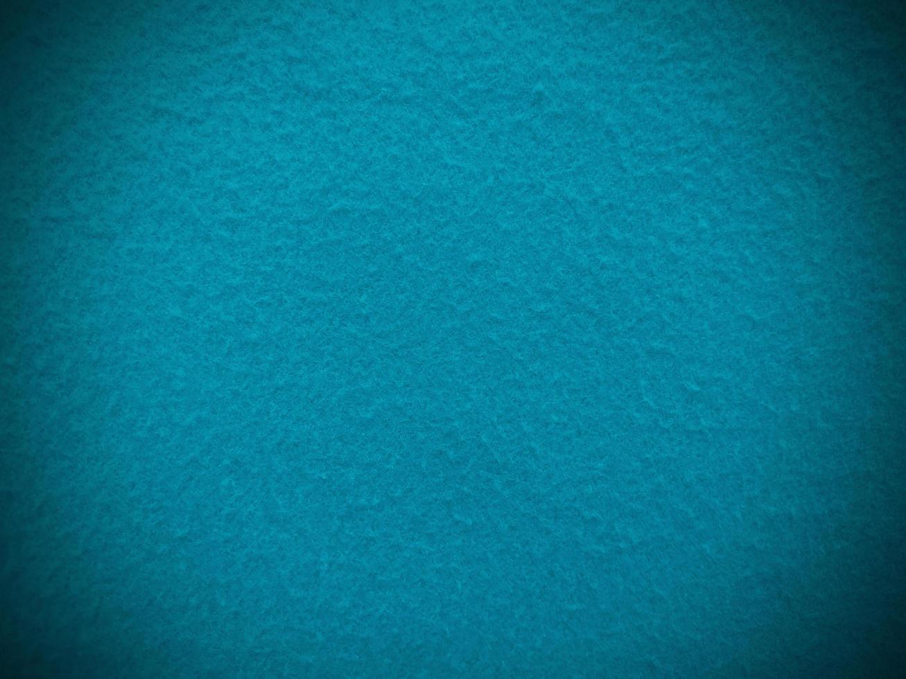 Felt  light blue soft rough textile material background texture close up,poker table,tennis ball,table cloth. Empty light blue fabric background. photo