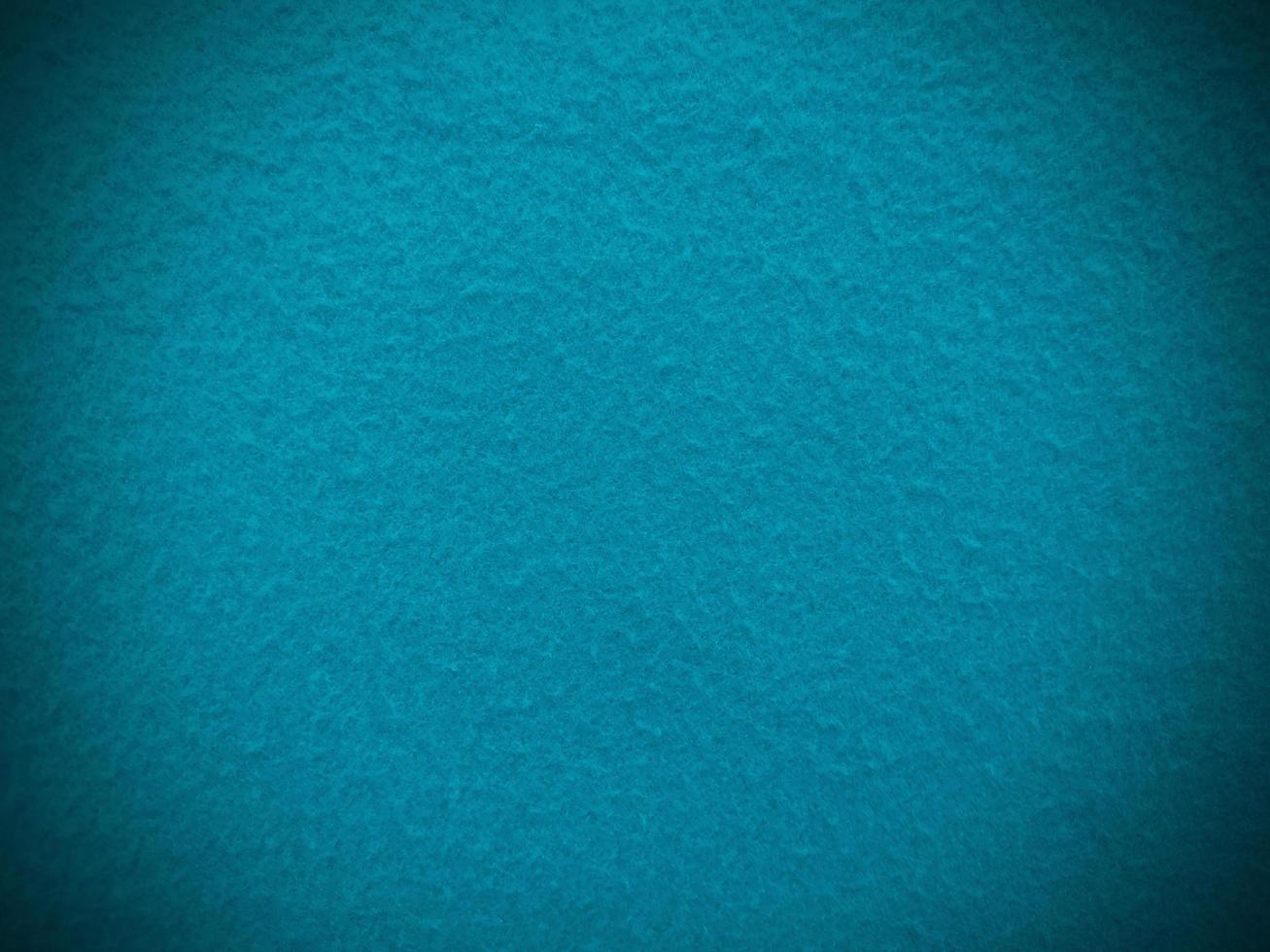 Felt  light blue soft rough textile material background texture close up,poker table,tennis ball,table cloth. Empty light blue fabric background. photo