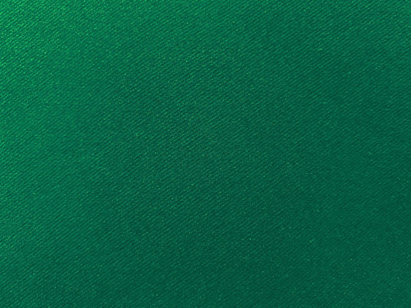 Dark green old velvet fabric texture used as background. Empty green fabric background of soft and smooth textile material. There is space for text... photo