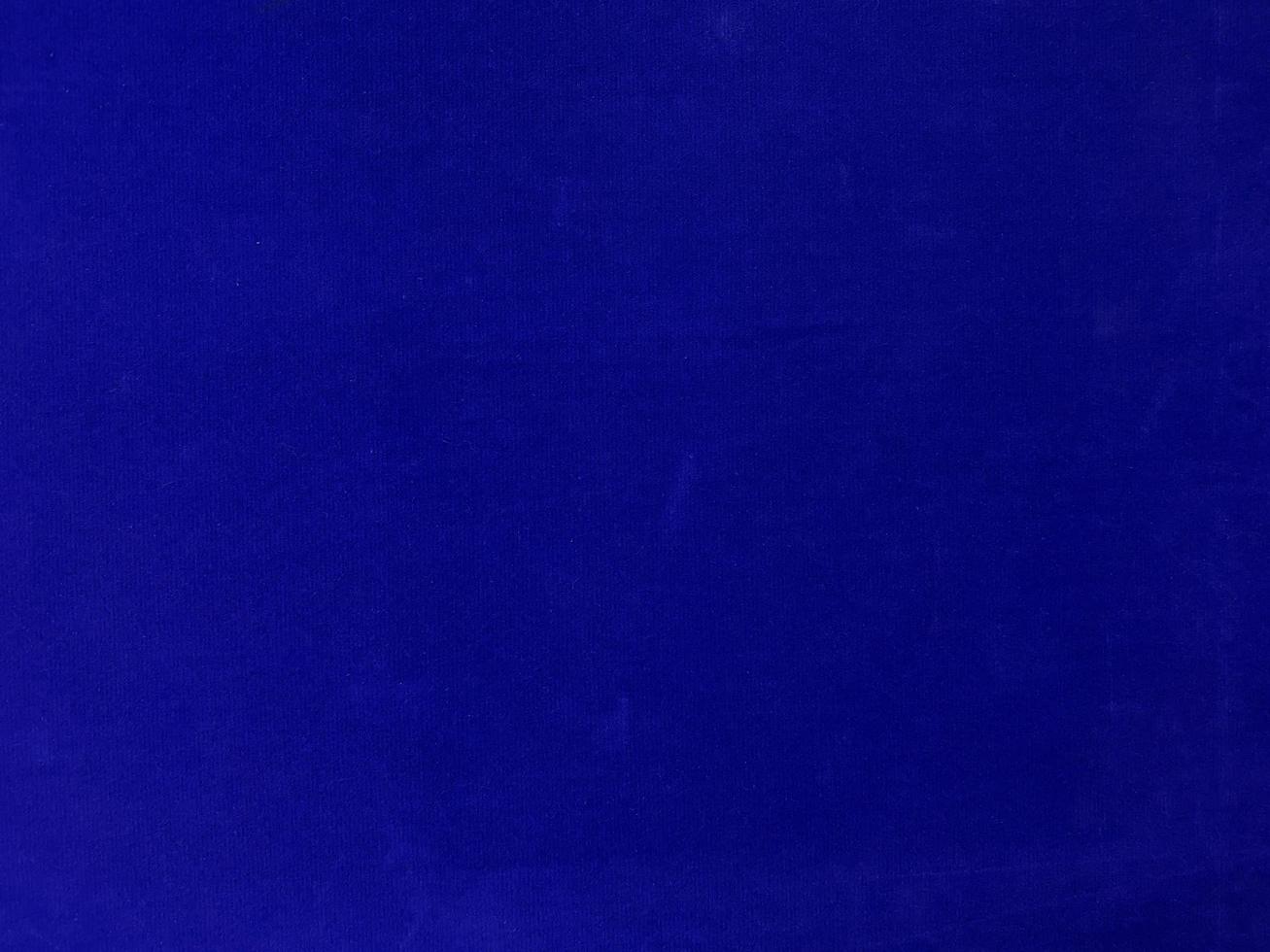 Blue velvet fabric texture used as background. Empty blue fabric background of soft and smooth textile material. There is space for text. photo