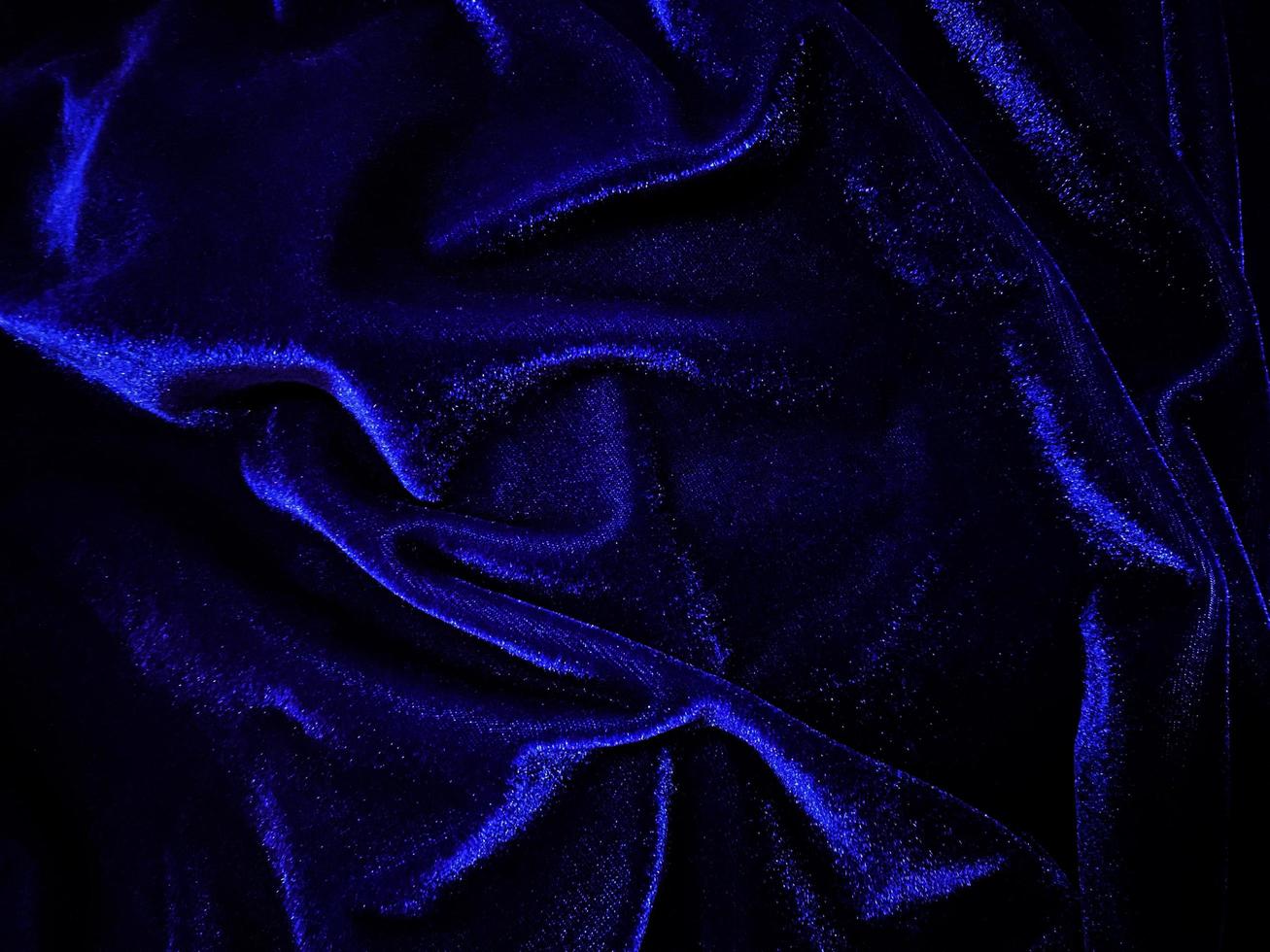 Blue velvet fabric texture used as background. Empty blue fabric background of soft and smooth textile material. There is space for text. photo