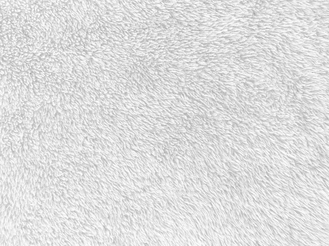 White clean wool texture background. light natural sheep wool. white seamless cotton. texture of fluffy fur for designers. close-up fragment white wool carpet.. photo
