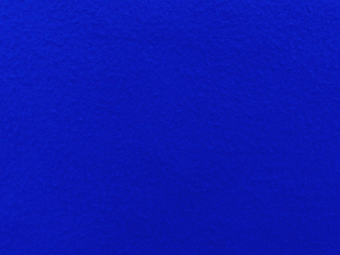 Felt  blue soft rough textile material background texture close up,poker table,tennis ball,table cloth. Empty blue fabric background. photo