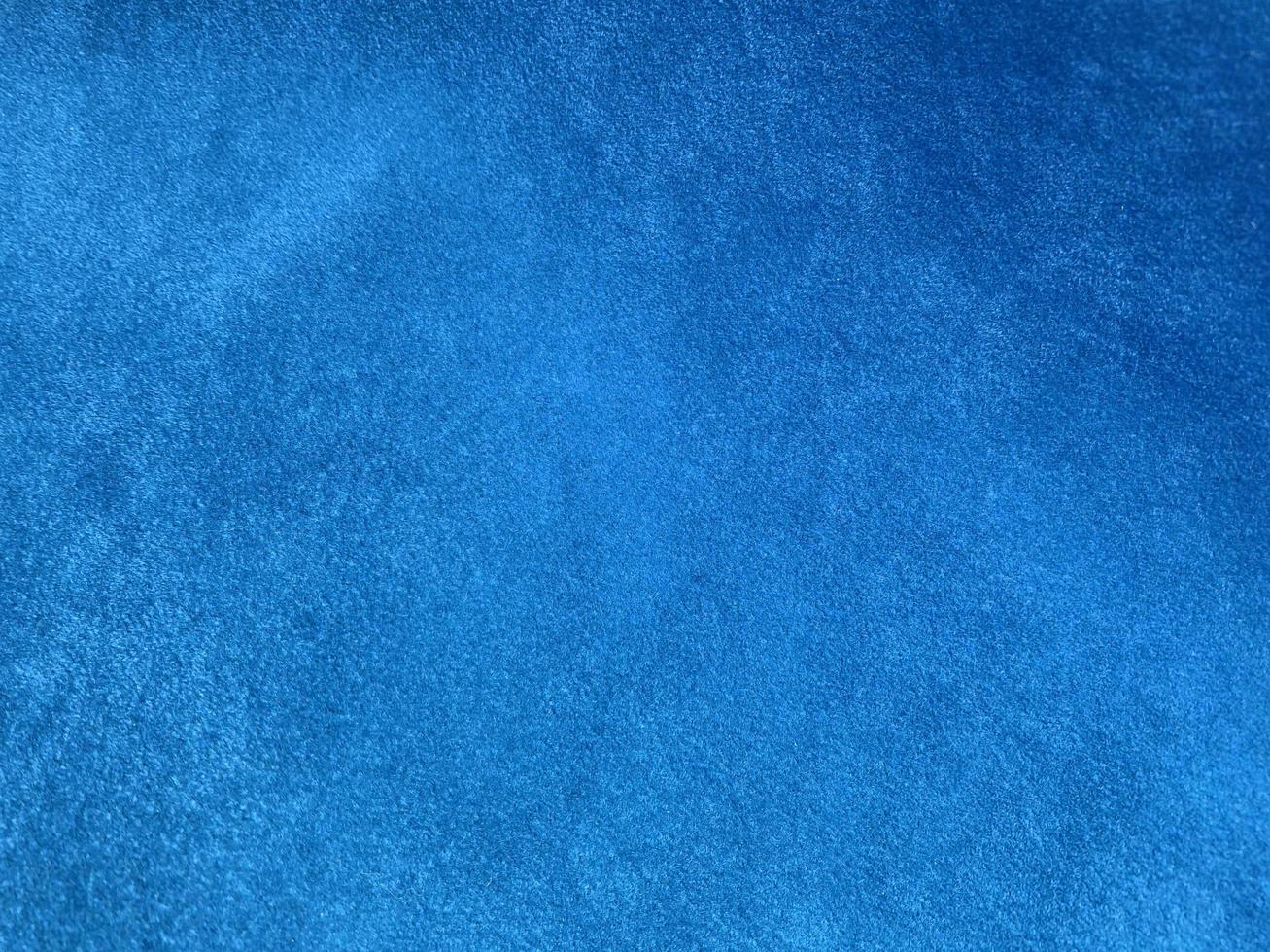 Light blue velvet fabric texture used as background. Empty light blue fabric background of soft and smooth textile material. There is space for text... photo