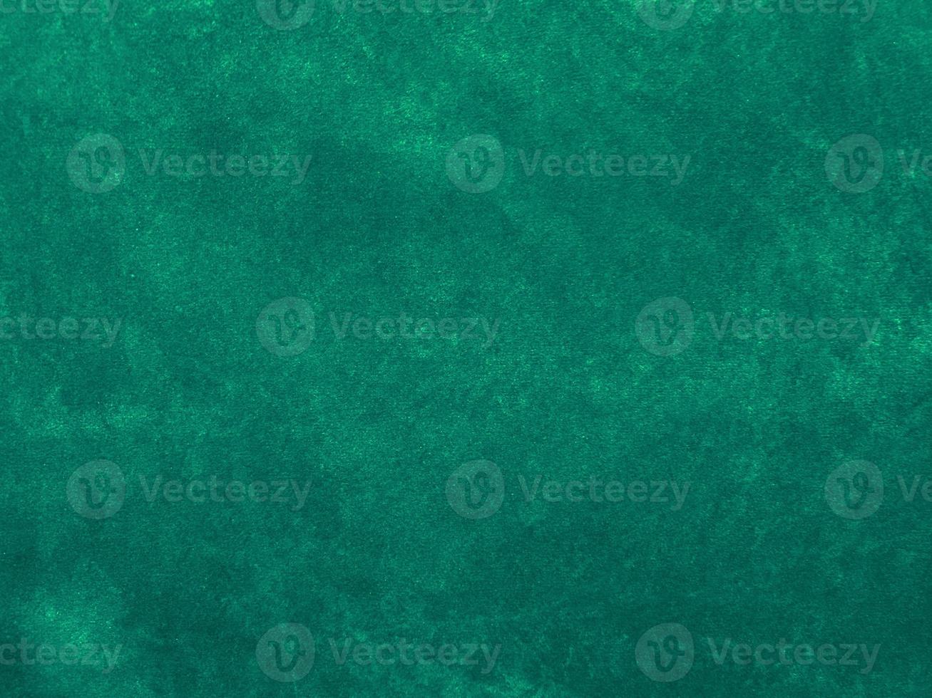 Dark green old velvet fabric texture used as background. Empty green fabric background of soft and smooth textile material. There is space for text... photo
