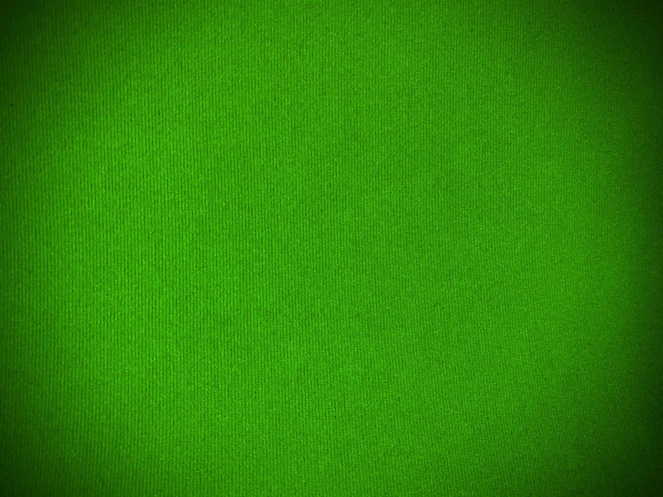 Green velvet fabric texture used as background. Empty green fabric background of soft and smooth textile material. There is space for text.. photo