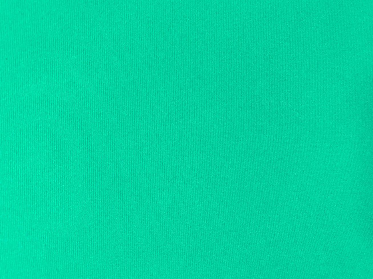 Mint green velvet fabric texture used as background. Empty green fabric background of soft and smooth textile material. There is space for text. photo