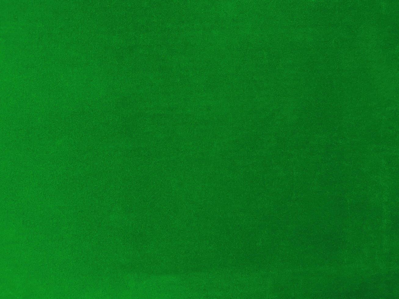 Green velvet fabric texture used as background. Empty  green  fabric background of soft and smooth textile material. There is space for text. photo