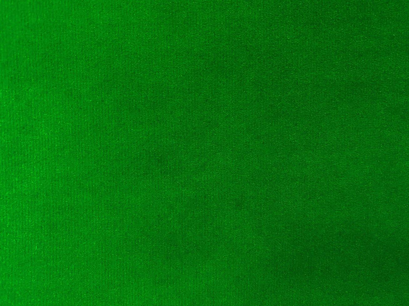 Green velvet fabric texture used as background. Empty  green  fabric background of soft and smooth textile material. There is space for text. photo