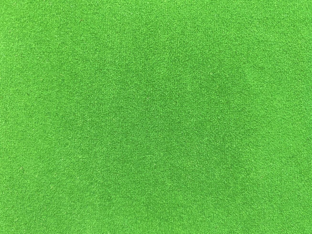 green velvet fabric texture used as background. Empty green fabric background of soft and smooth textile material. There is space for text. photo
