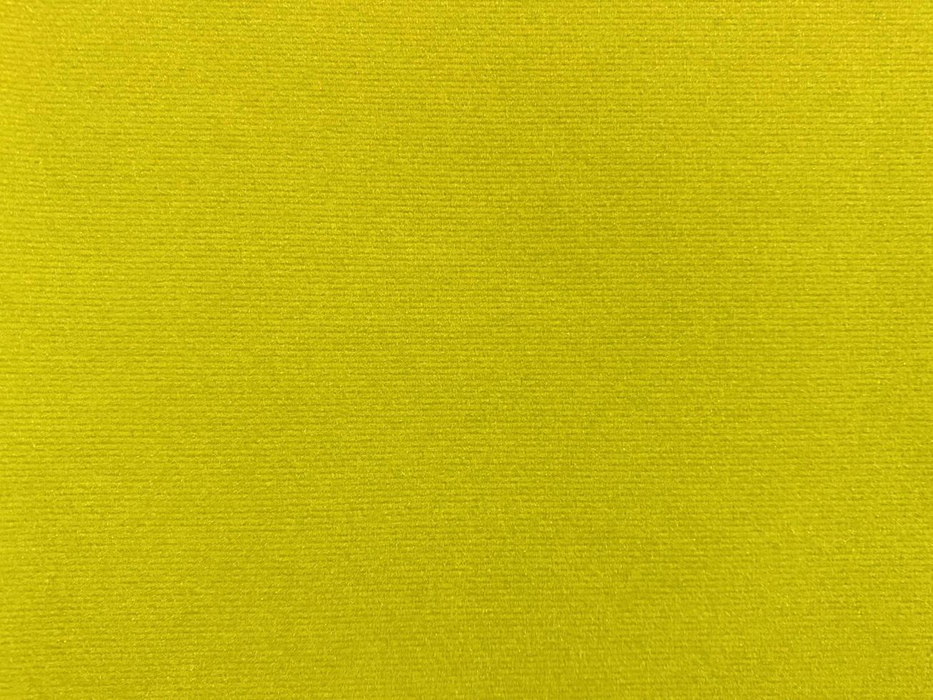 yellow velvet fabric texture used as background. Empty yellow fabric background of soft and smooth textile material. There is space for text.. photo
