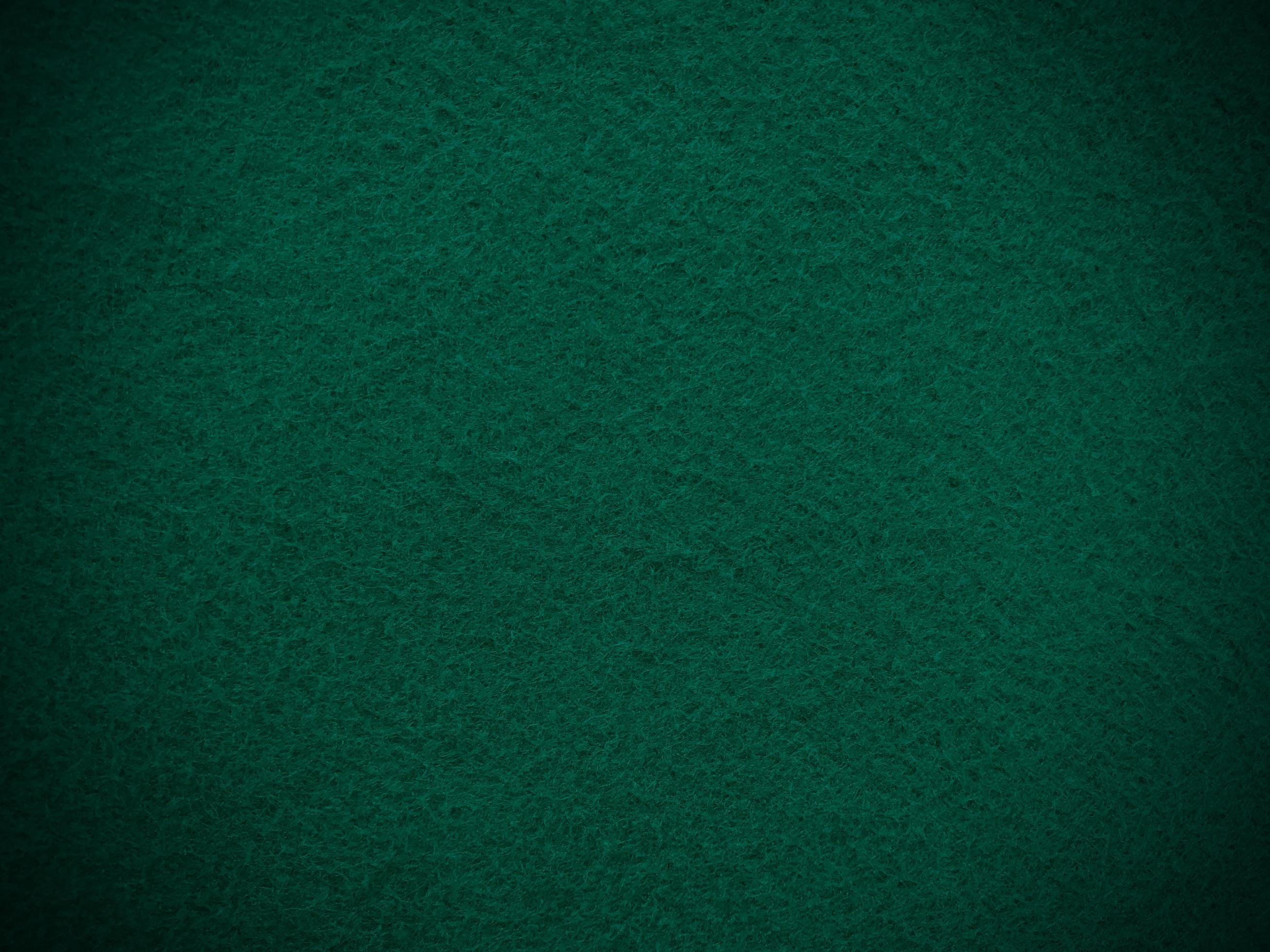 Felt dark green soft rough textile material background texture