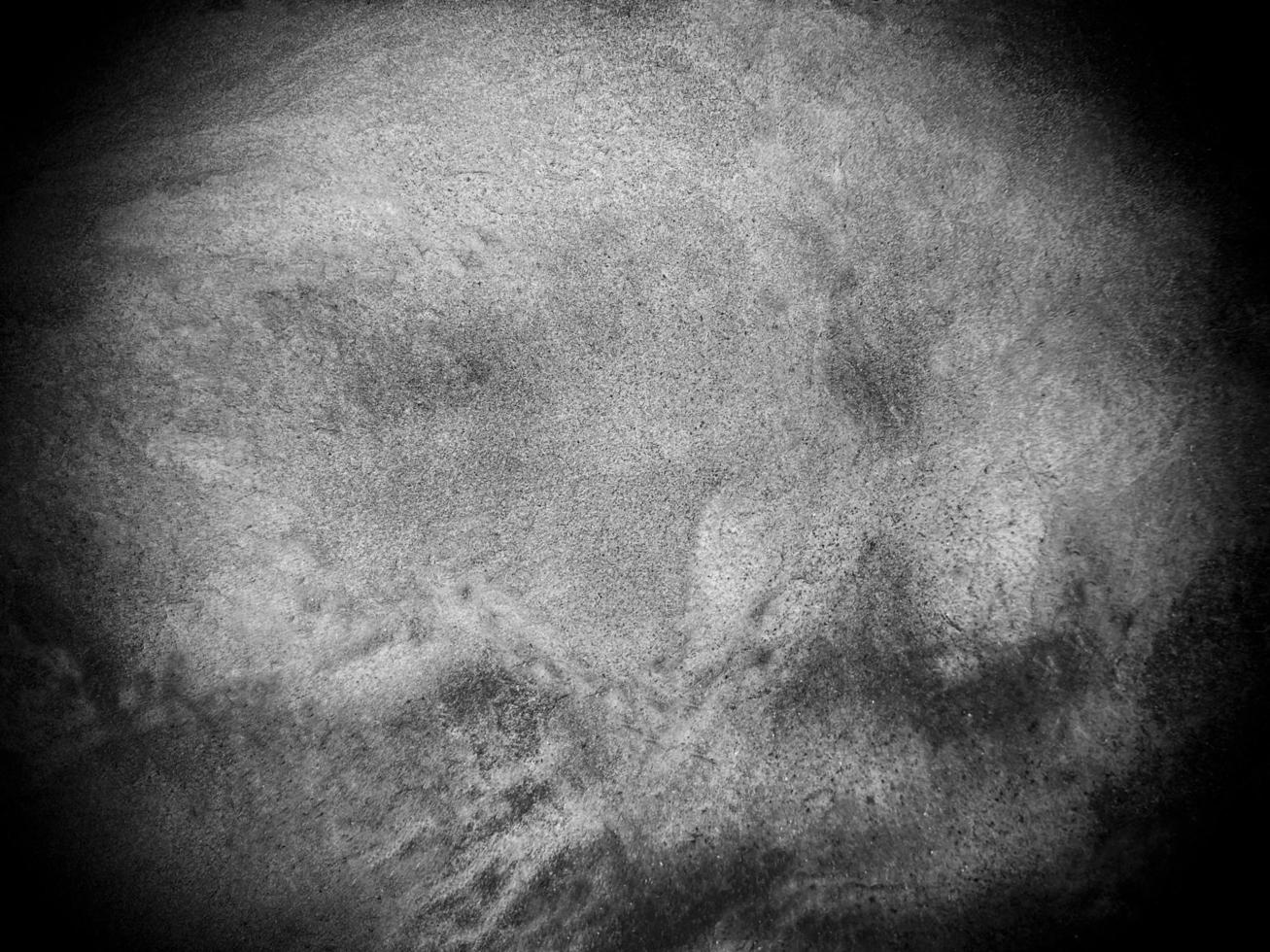 Surface of the dark black stone texture rough, gray-white tone. Use this for wallpaper or background image. There is a blank space for text photo