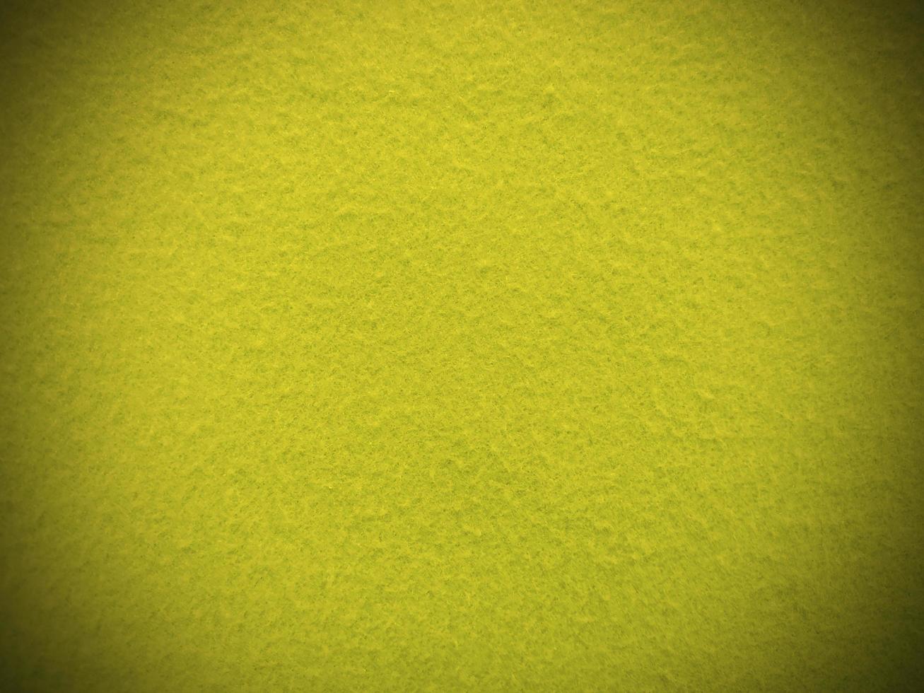 Felt yellow soft rough textile material background texture close up,poker table,tennis ball,table cloth. Empty yellow fabric background. photo