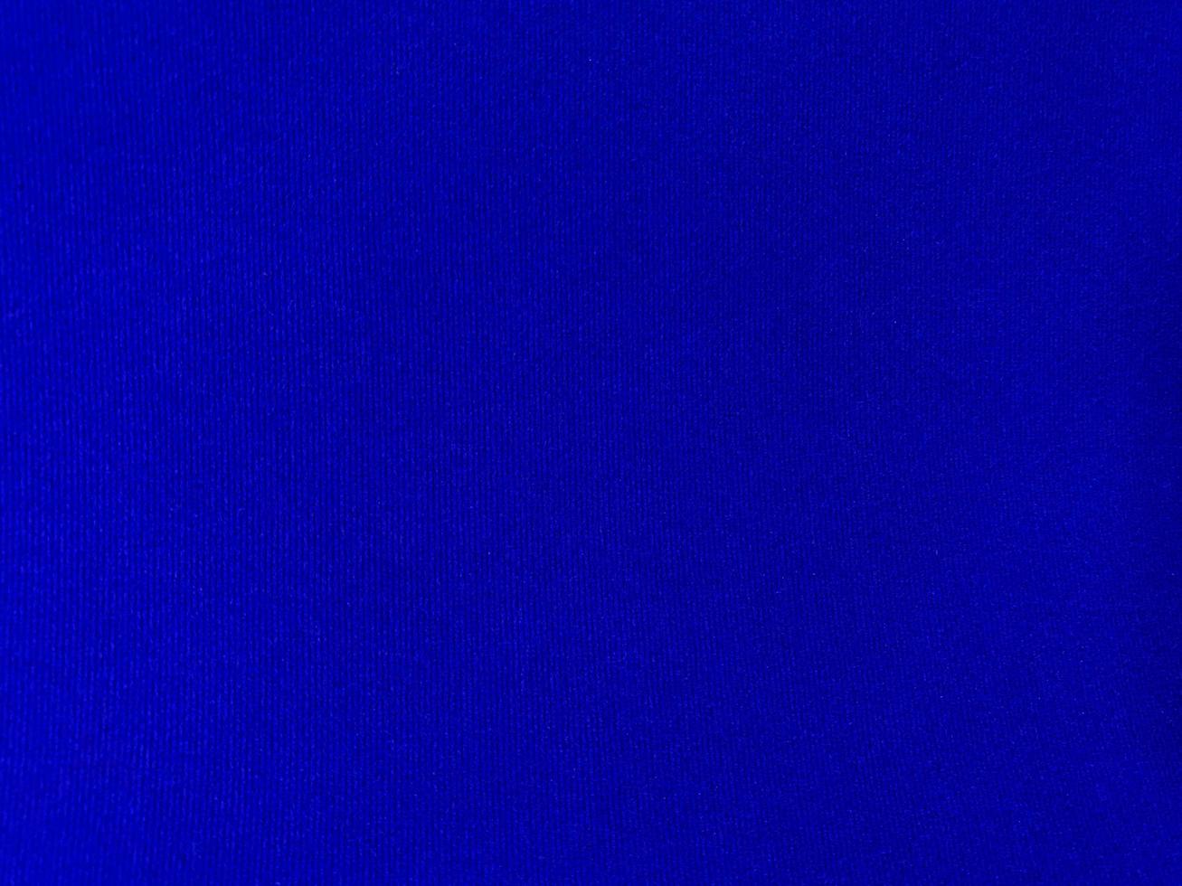 Dark blue velvet fabric texture used as background. Empty dark blue fabric background of soft and smooth textile material. There is space for text. photo