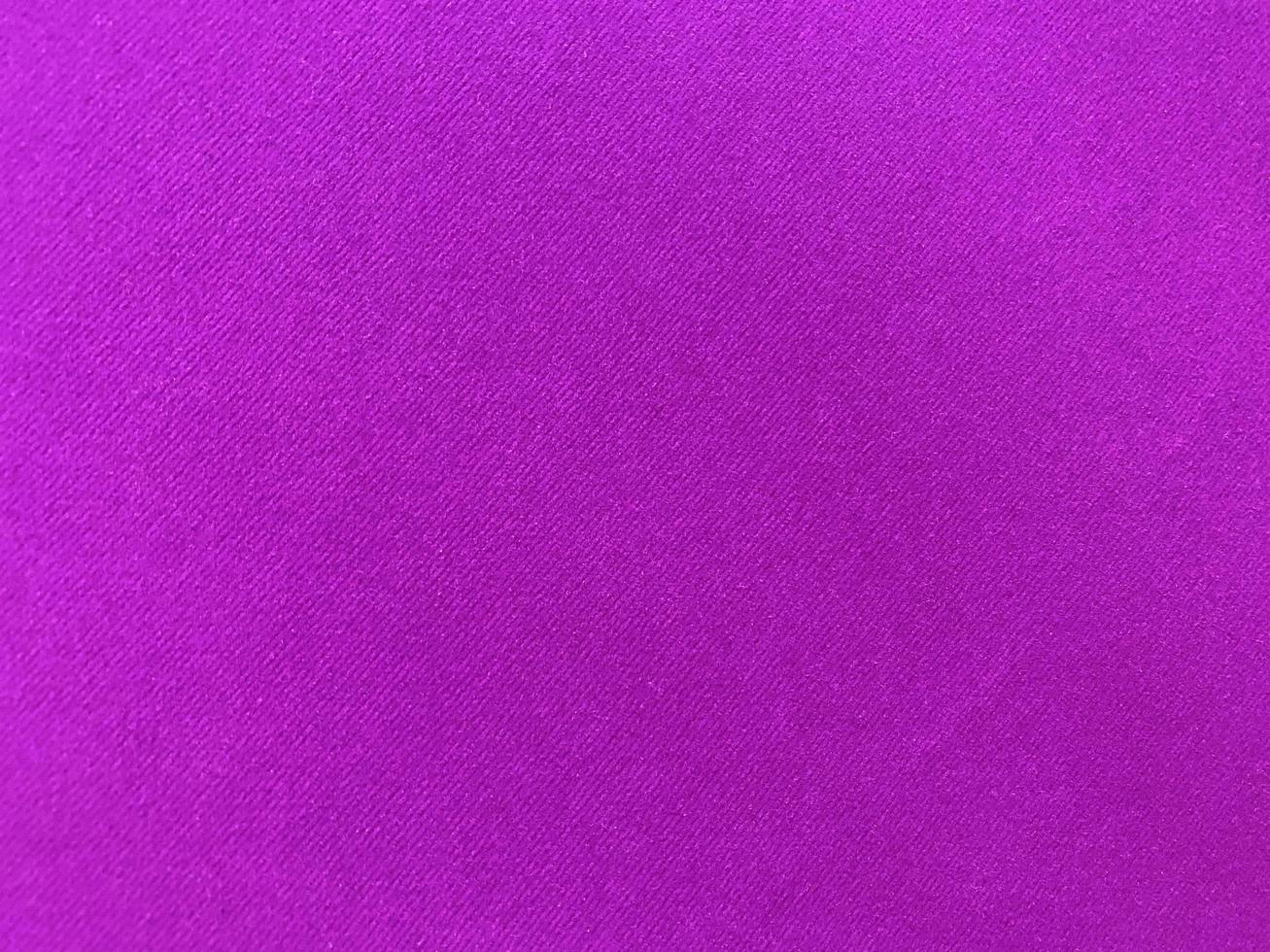 Dark purple old velvet fabric texture used as background. Empty purple fabric background of soft and smooth textile material. There is space for text... photo
