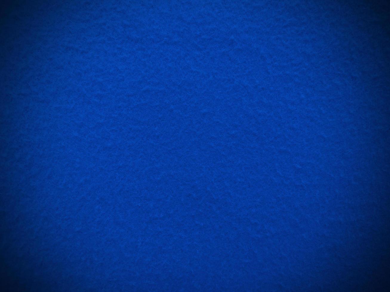 Felt  blue soft rough textile material background texture close up,poker table,tennis ball,table cloth. Empty blue fabric background. photo
