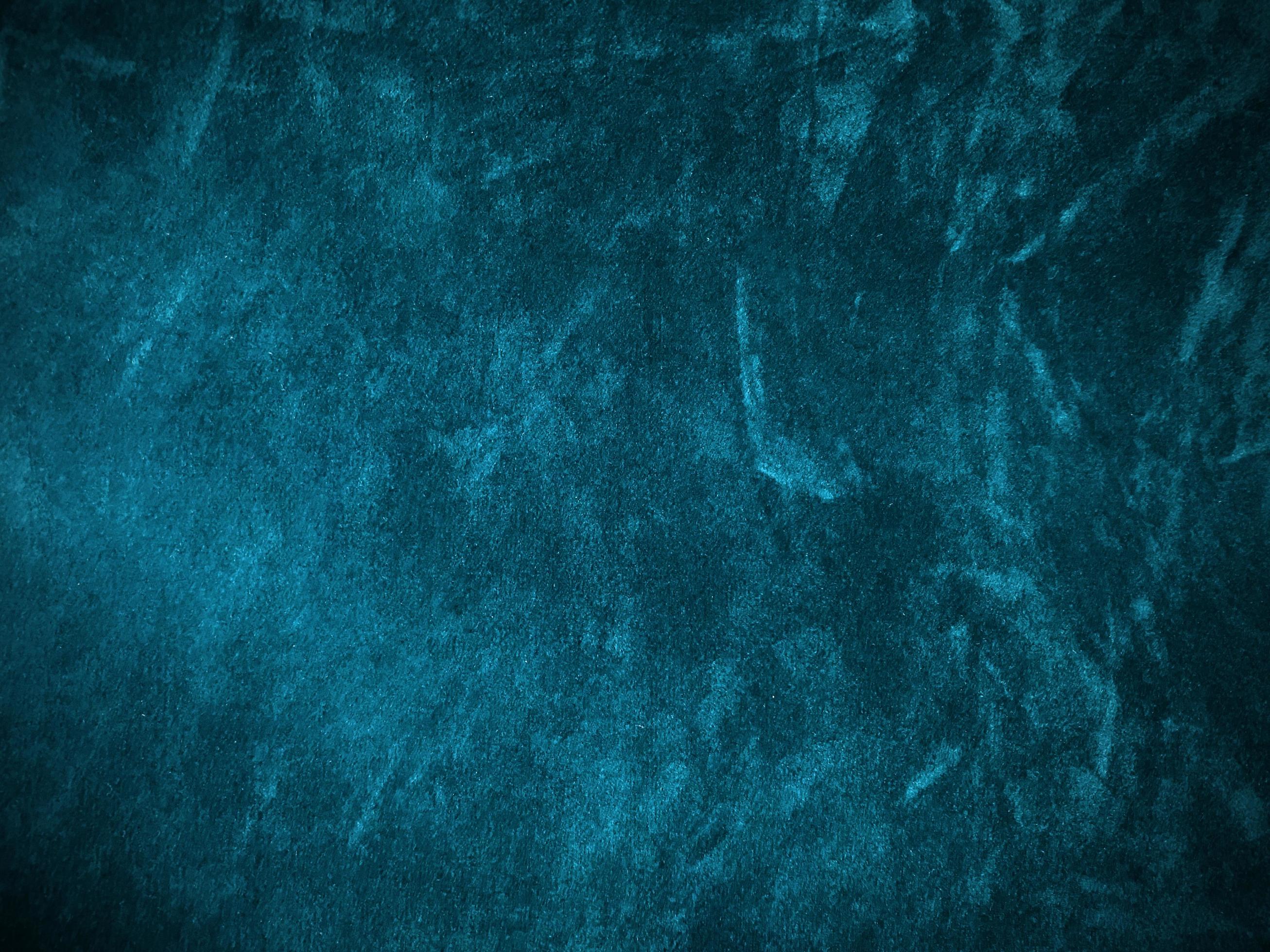 Dark blue marine velvet fabric texture used as background. Empty dark