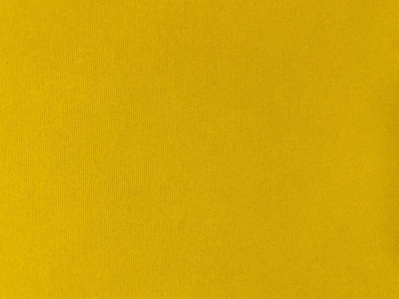 Yellow velvet fabric texture used as background. Empty yellow fabric background of soft and smooth textile material. There is space for text. photo
