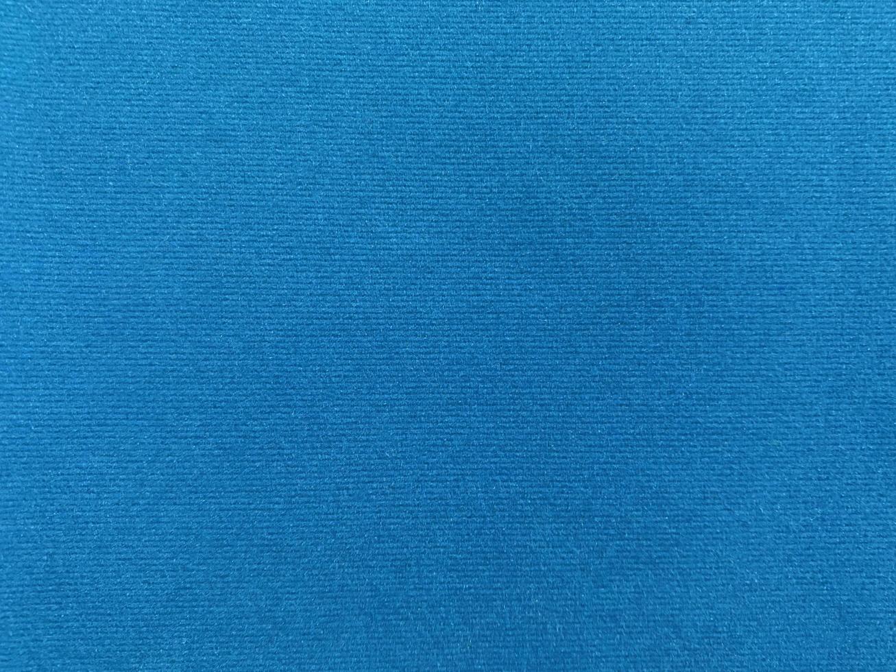 Blue velvet fabric texture used as background. Empty blue fabric background of soft and smooth textile material. There is space for text. photo