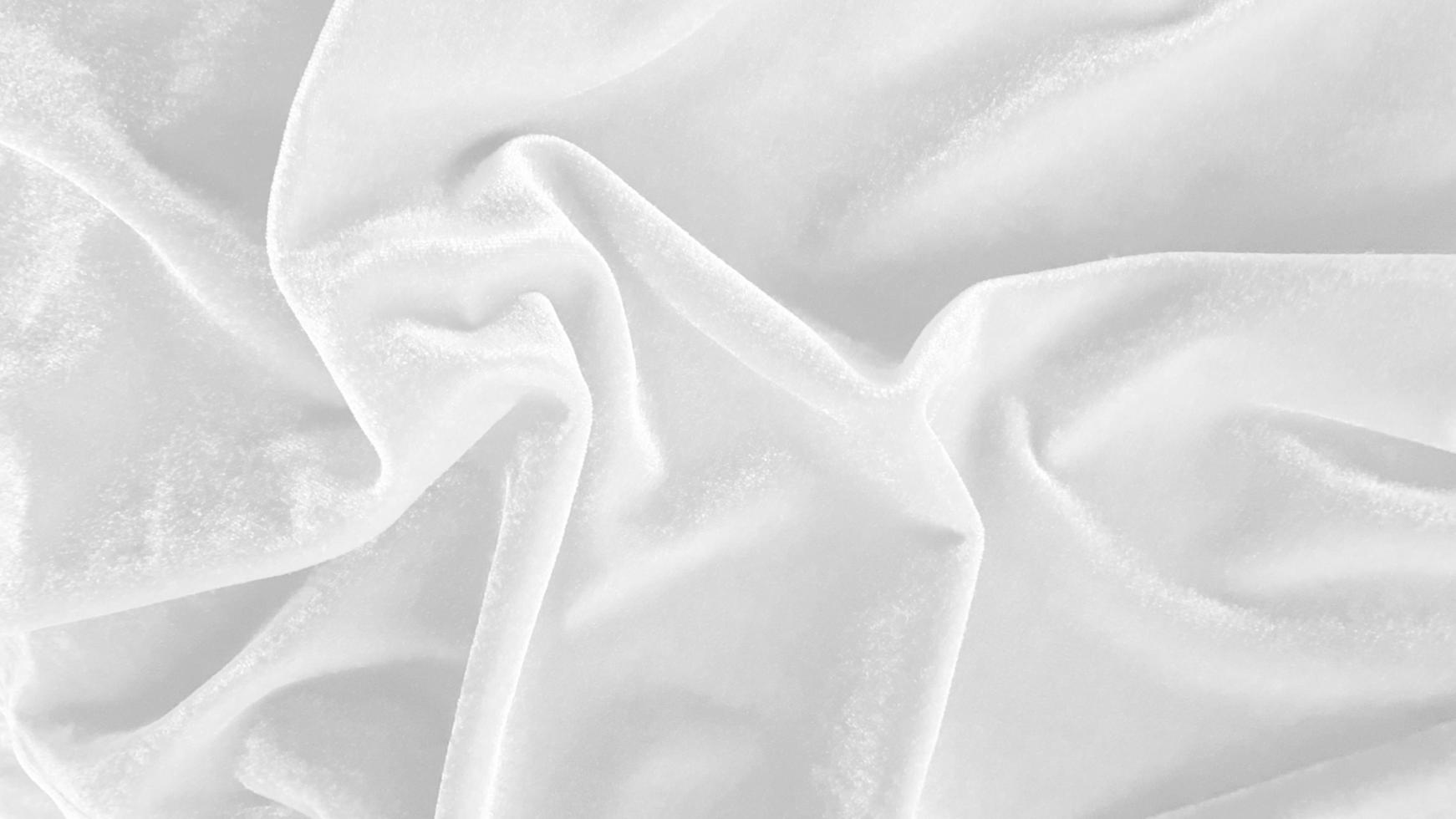 White velvet fabric texture used as background. Empty white fabric background of soft and smooth textile material. There is space for text. photo