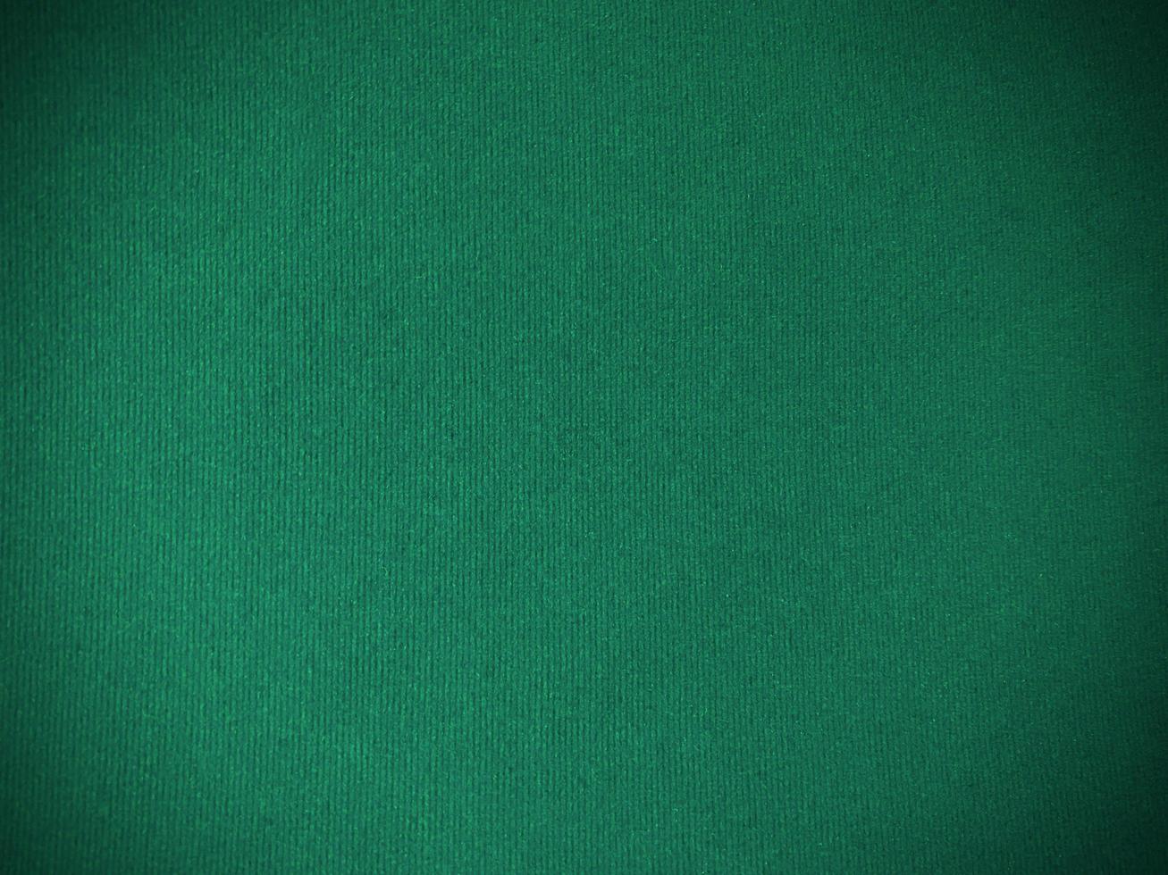 Dark green old velvet fabric texture used as background. Empty green fabric background of soft and smooth textile material. There is space for text.. photo