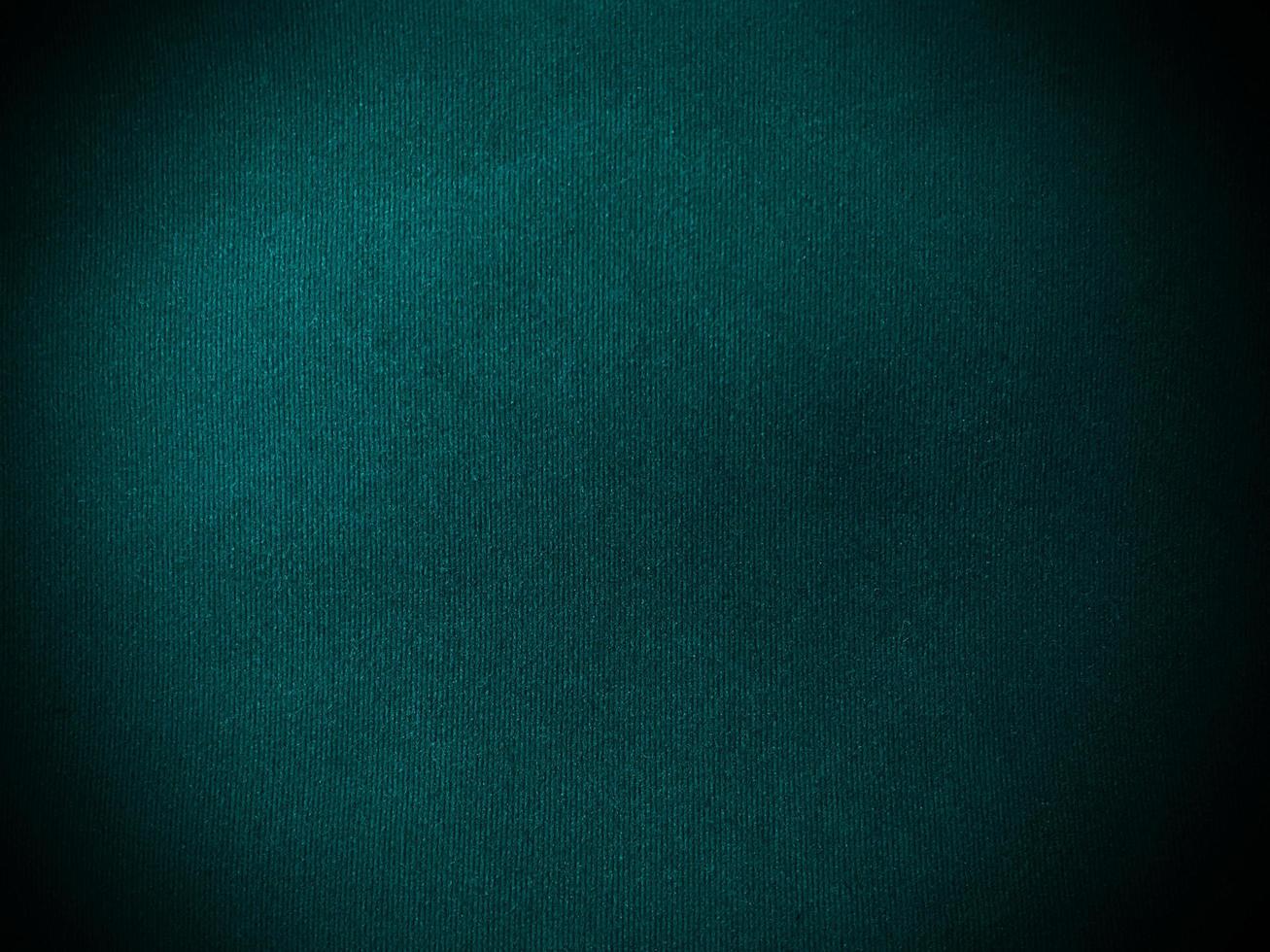 Dark  green velvet fabric texture used as background. Empty green fabric background of soft and smooth textile material. There is space for text. photo