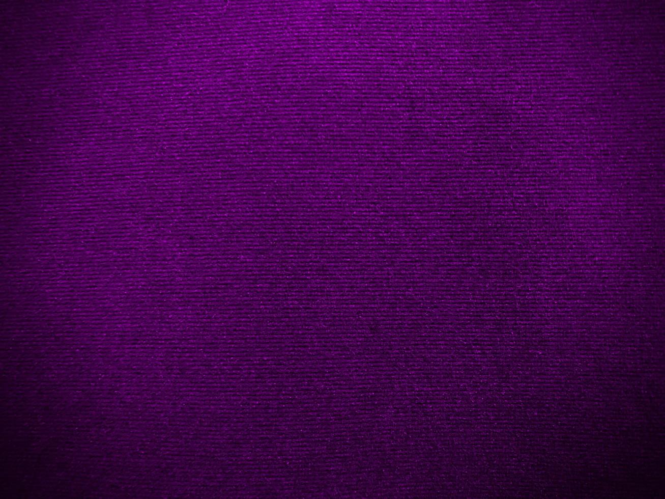 Dark purple velvet fabric texture used as background. Empty purple fabric background of soft and smooth textile material. There is space for text. photo