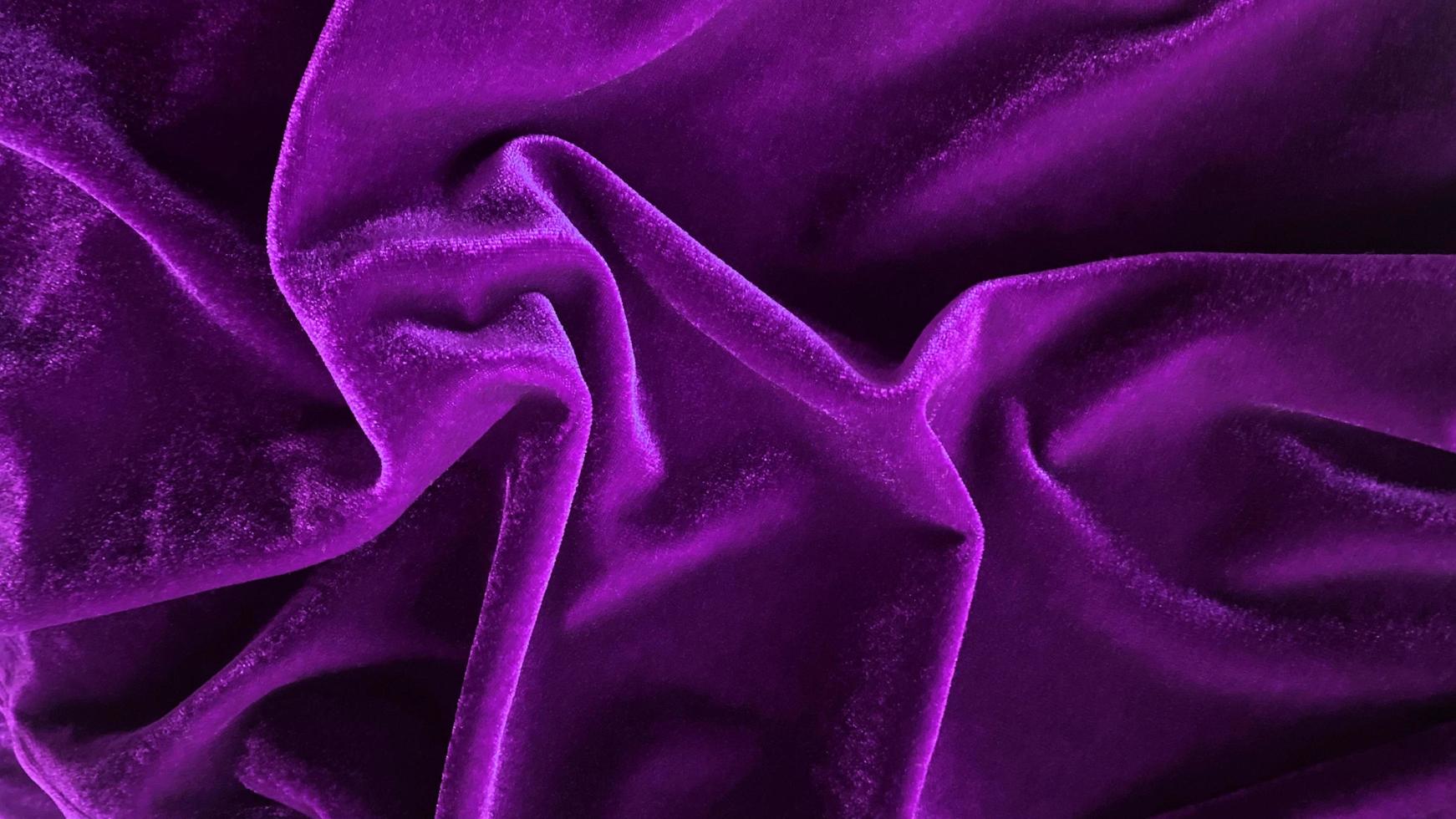 Purple velvet fabric texture used as background. Empty purple fabric background of soft and smooth textile material. There is space for text. photo