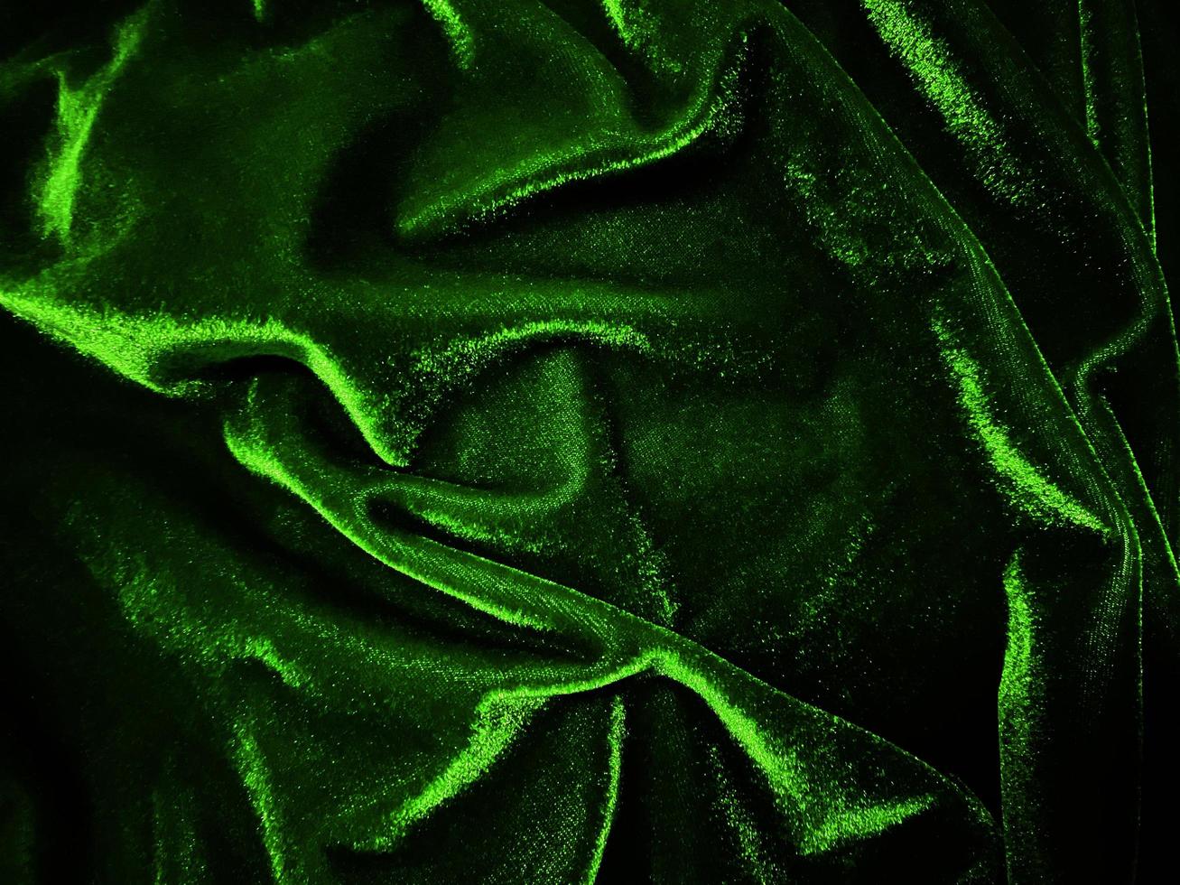 Green velvet fabric texture used as background. Empty green fabric background of soft and smooth textile material. There is space for text. photo